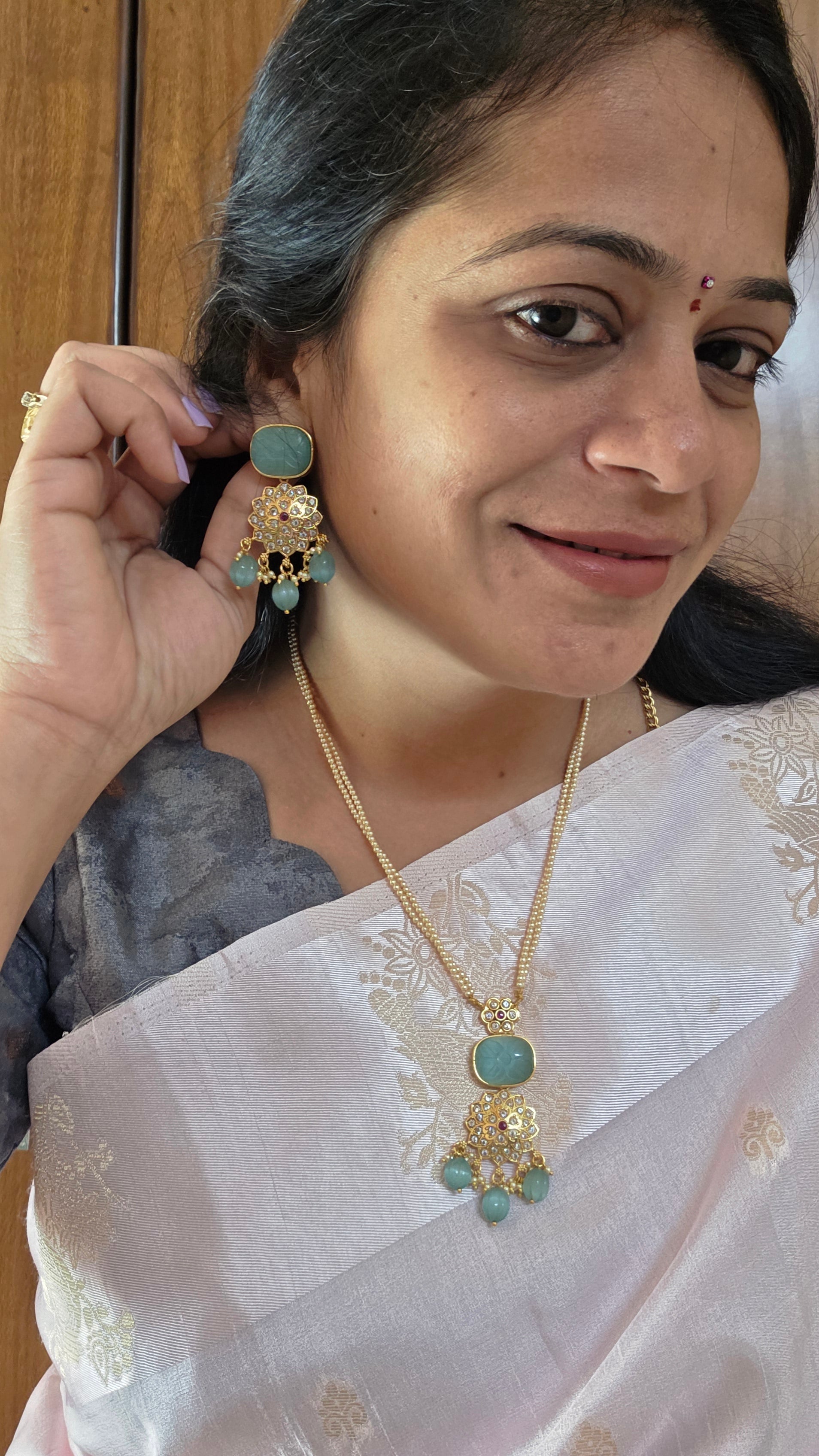 Aditi's Fusion carving gold replica pendant set